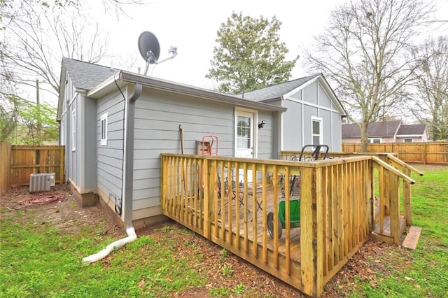 rear view of house featuring a deck and central air condition unit