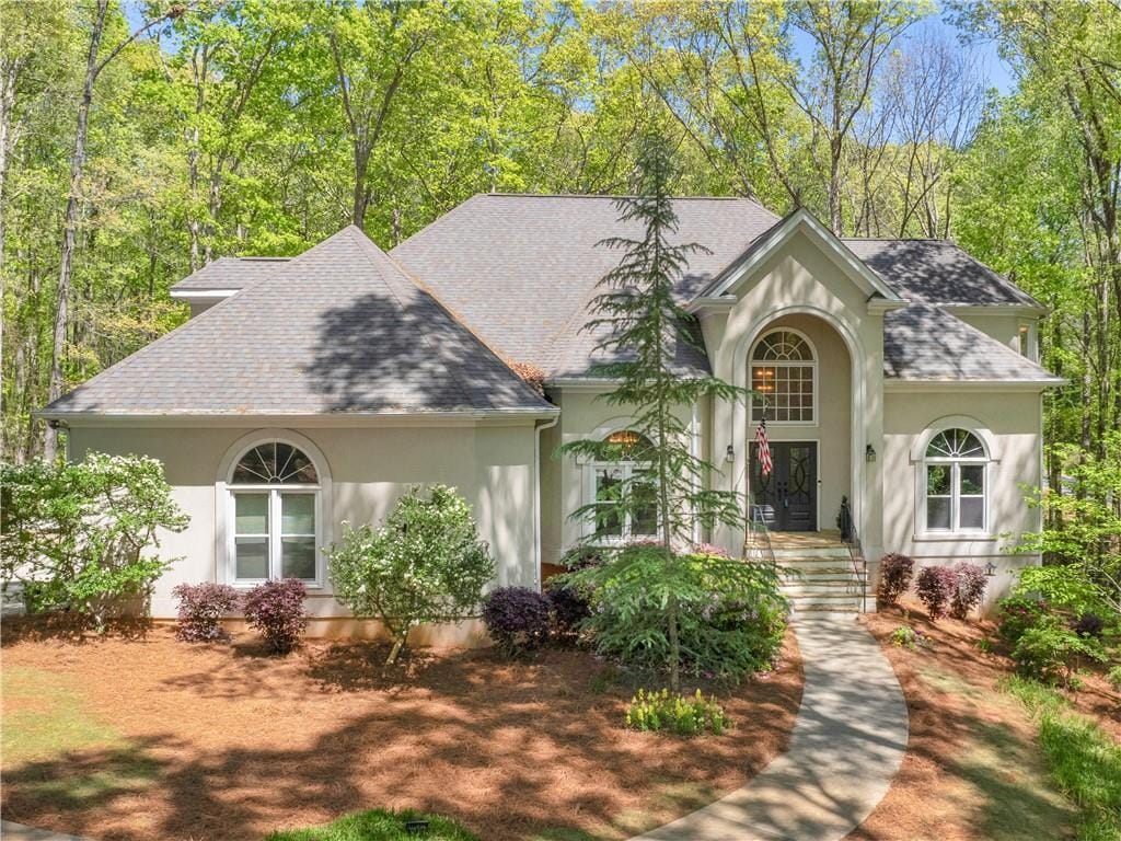 3500 Lost Valley Dr, Jonesboro, GA 30236 - view of front facade featuring roof with shingles and stucco siding