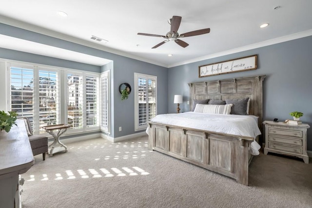 bedroom with ornamental molding, light colored carpet, and ceiling fan