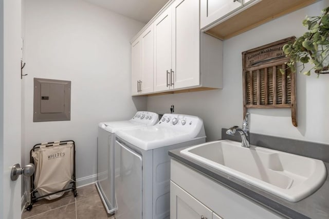 laundry area with washer and dryer, sink, cabinets, tile patterned flooring, and electric panel