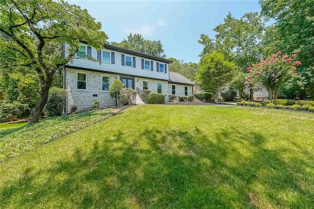 back of house featuring a yard