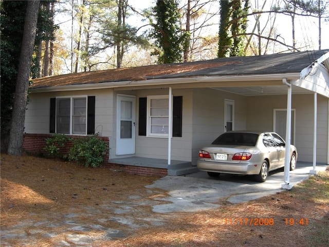 ranch-style house with a carport