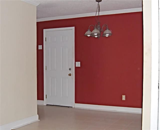 interior space with crown molding and a chandelier