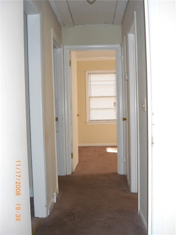 hallway with dark carpet