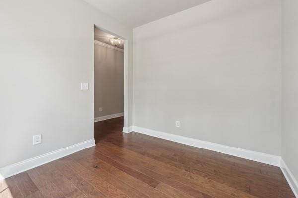 bathroom featuring hardwood / wood-style floors and toilet