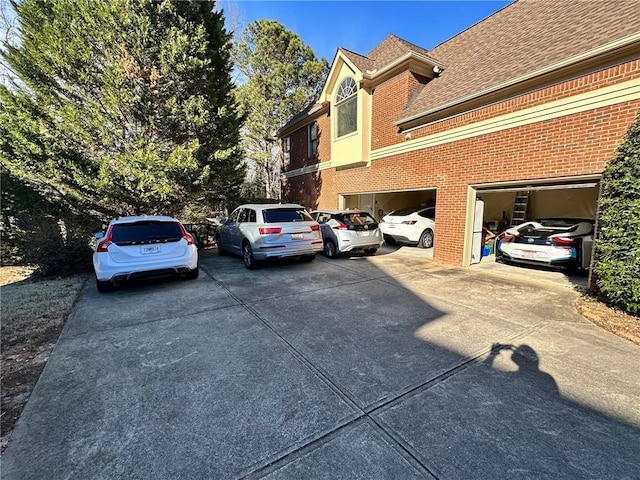 view of car parking with a garage