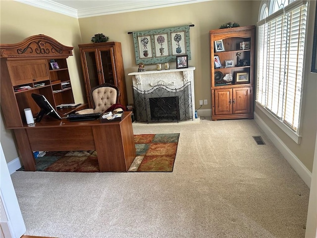 carpeted home office with crown molding and a fireplace