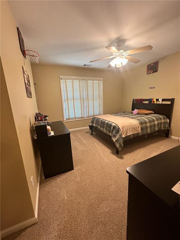 bedroom featuring carpet floors and ceiling fan