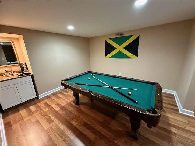 game room with hardwood / wood-style floors and billiards