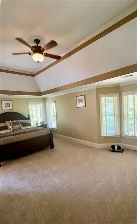 unfurnished bedroom with multiple windows, ceiling fan, crown molding, and vaulted ceiling