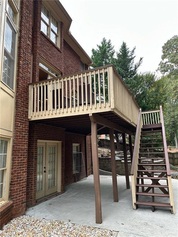 exterior space with french doors, a patio, and a wooden deck