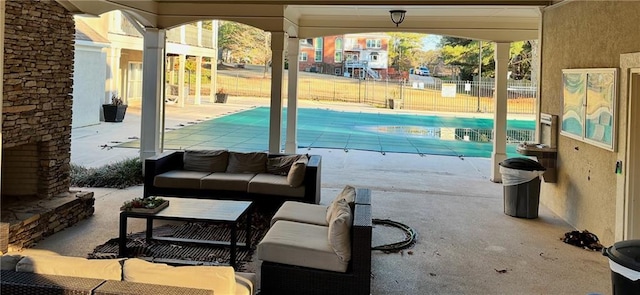 view of patio / terrace featuring outdoor lounge area and a covered pool