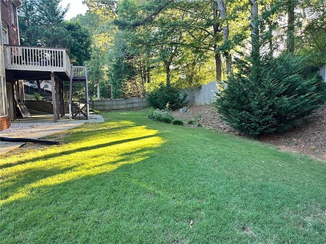 view of yard featuring a wooden deck