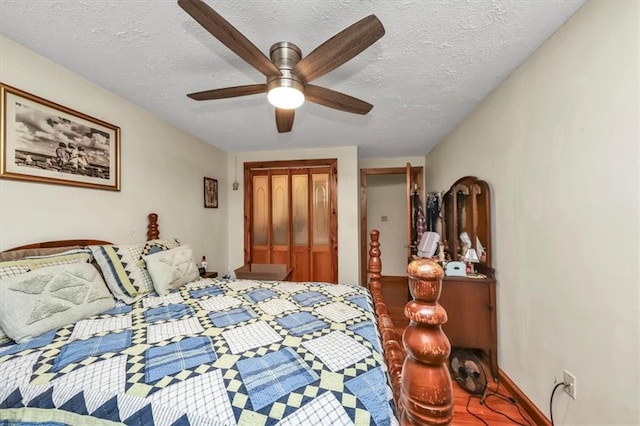 bedroom with a textured ceiling, a closet, and ceiling fan