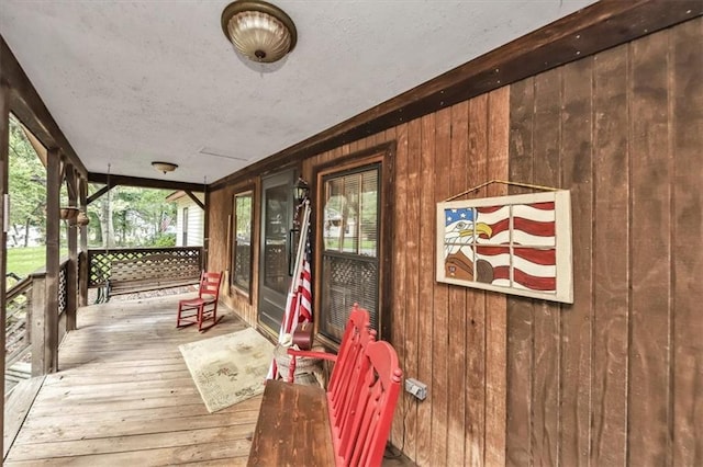 wooden deck featuring covered porch