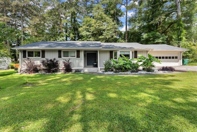 1467 Hewatt Rd, Lilburn, GA 30047 - ranch-style home featuring a garage, driveway, and a front yard
