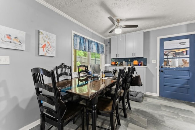 1467 Hewatt Rd, Lilburn, GA 30047 - dining room with ornamental molding, baseboards, ceiling fan, and a textured ceiling