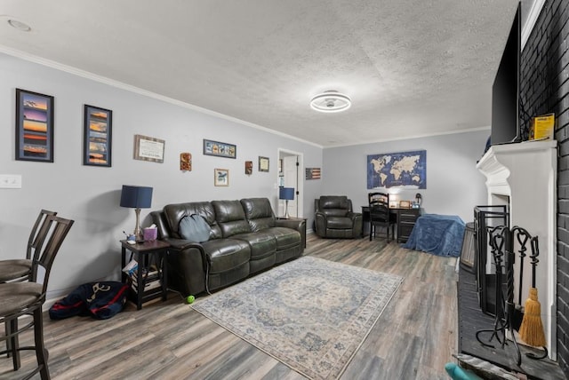 1467 Hewatt Rd, Lilburn, GA 30047 - living area with wood finished floors, ornamental molding, a fireplace with raised hearth, and baseboards