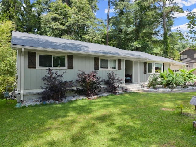 1467 Hewatt Rd, Lilburn, GA 30047 - ranch-style house with a front yard and board and batten siding