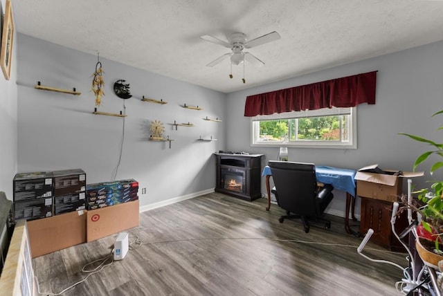 1467 Hewatt Rd, Lilburn, GA 30047 - office featuring wood finished floors, ceiling fan, a textured ceiling, and baseboards