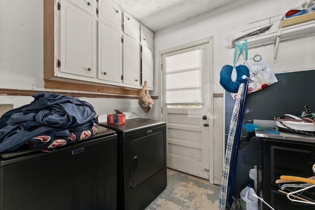 1467 Hewatt Rd, Lilburn, GA 30047 - laundry room with cabinet space, washing machine and clothes dryer, and a textured ceiling