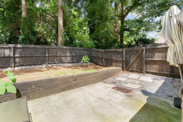 1467 Hewatt Rd, Lilburn, GA 30047 - fenced backyard featuring a patio