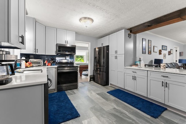 1467 Hewatt Rd, Lilburn, GA 30047 - kitchen with stainless steel appliances, light countertops, backsplash, a textured ceiling, and ornamental molding