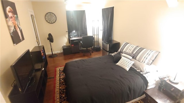 bedroom featuring dark hardwood / wood-style flooring