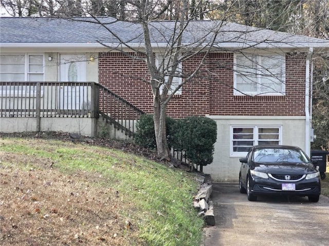 view of side of home featuring a yard