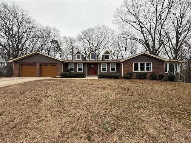 ranch-style house featuring a garage and a front lawn