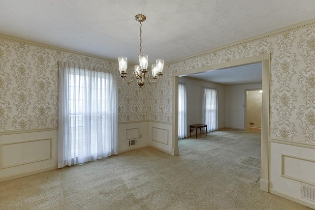 unfurnished dining area with a chandelier and light carpet