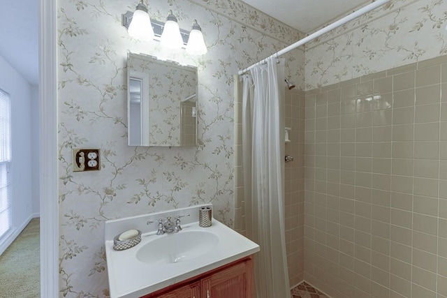 bathroom featuring a shower with shower curtain and vanity