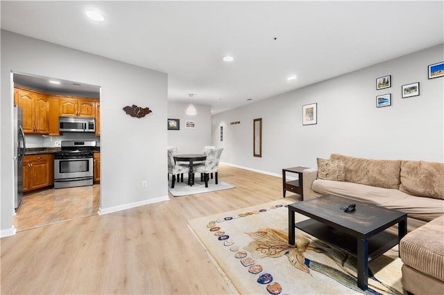 472 Sherman Way, Decatur, GA 30033 - living room featuring recessed lighting, light wood-style floors, and baseboards