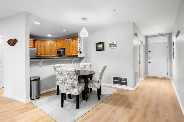 472 Sherman Way, Decatur, GA 30033 - dining room featuring light wood finished floors, recessed lighting, and baseboards