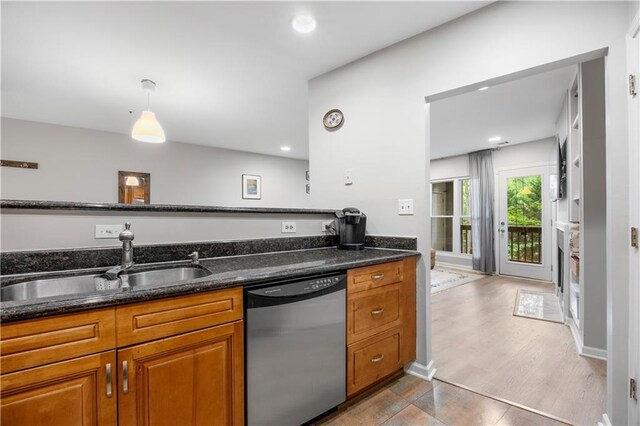 472 Sherman Way, Decatur, GA 30033 - kitchen with dishwasher, a sink, brown cabinetry, dark stone countertops, and recessed lighting