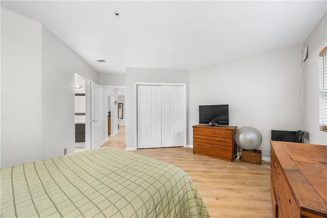 472 Sherman Way, Decatur, GA 30033 - bedroom featuring light wood-type flooring, a closet, and baseboards