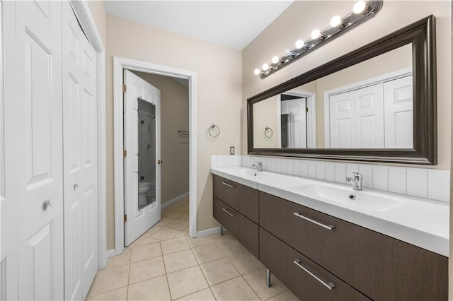472 Sherman Way, Decatur, GA 30033 - full bathroom with a closet, tile patterned floors, double vanity, baseboards, and toilet
