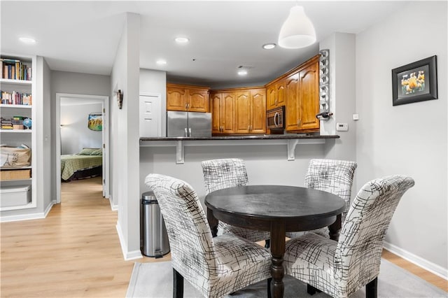 472 Sherman Way, Decatur, GA 30033 - dining room featuring light wood finished floors, recessed lighting, and baseboards