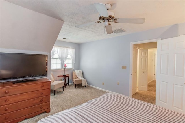 bedroom with carpet floors, visible vents, ceiling fan, a textured ceiling, and baseboards