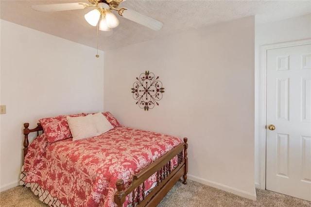 bedroom featuring ceiling fan, baseboards, and light colored carpet