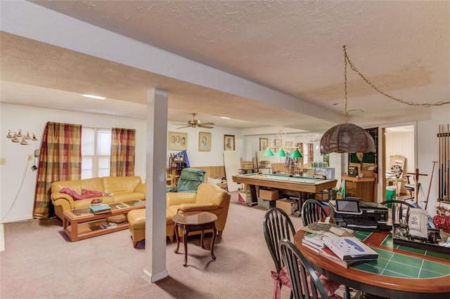 dining area featuring carpet floors, billiards, and a textured ceiling