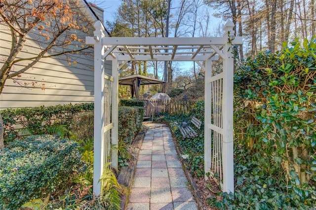 view of patio / terrace with fence and a pergola