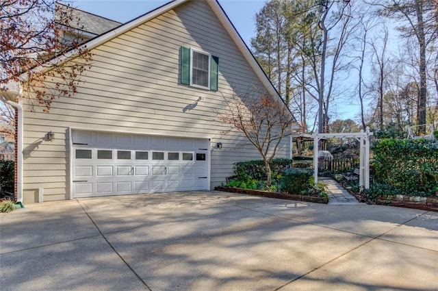 view of home's exterior featuring driveway and an attached garage