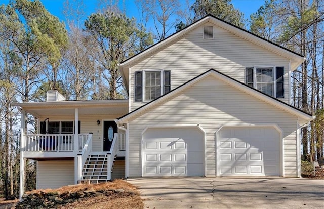 view of front of home featuring a garage and covered porch