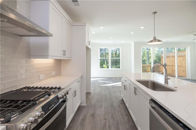 2260 Siskin Square Rd Unit 90, Duluth, GA 30096 - kitchen with stainless steel appliances, wall chimney range hood, a sink, healthy amount of natural light, and recessed lighting