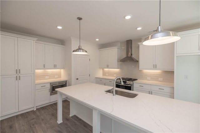 2260 Siskin Square Rd Unit 90, Duluth, GA 30096 - kitchen featuring wall chimney range hood, a sink, appliances with stainless steel finishes, white cabinets, and tasteful backsplash
