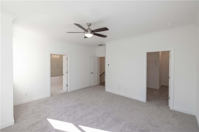 2260 Siskin Square Rd Unit 90, Duluth, GA 30096 - unfurnished bedroom featuring a walk in closet, crown molding, carpet, baseboards, and a ceiling fan