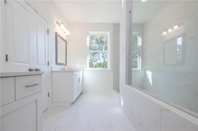 2260 Siskin Square Rd Unit 90, Duluth, GA 30096 - bathroom featuring marble look tiles, vanity, walk in shower, and baseboards