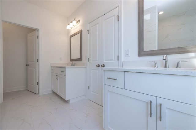 2260 Siskin Square Rd Unit 90, Duluth, GA 30096 - bathroom featuring marble finish floors, two vanities, baseboards, and recessed lighting