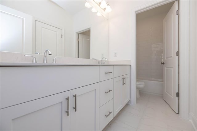 2260 Siskin Square Rd Unit 90, Duluth, GA 30096 - bathroom featuring marble look tile flooring, toilet, and double vanity